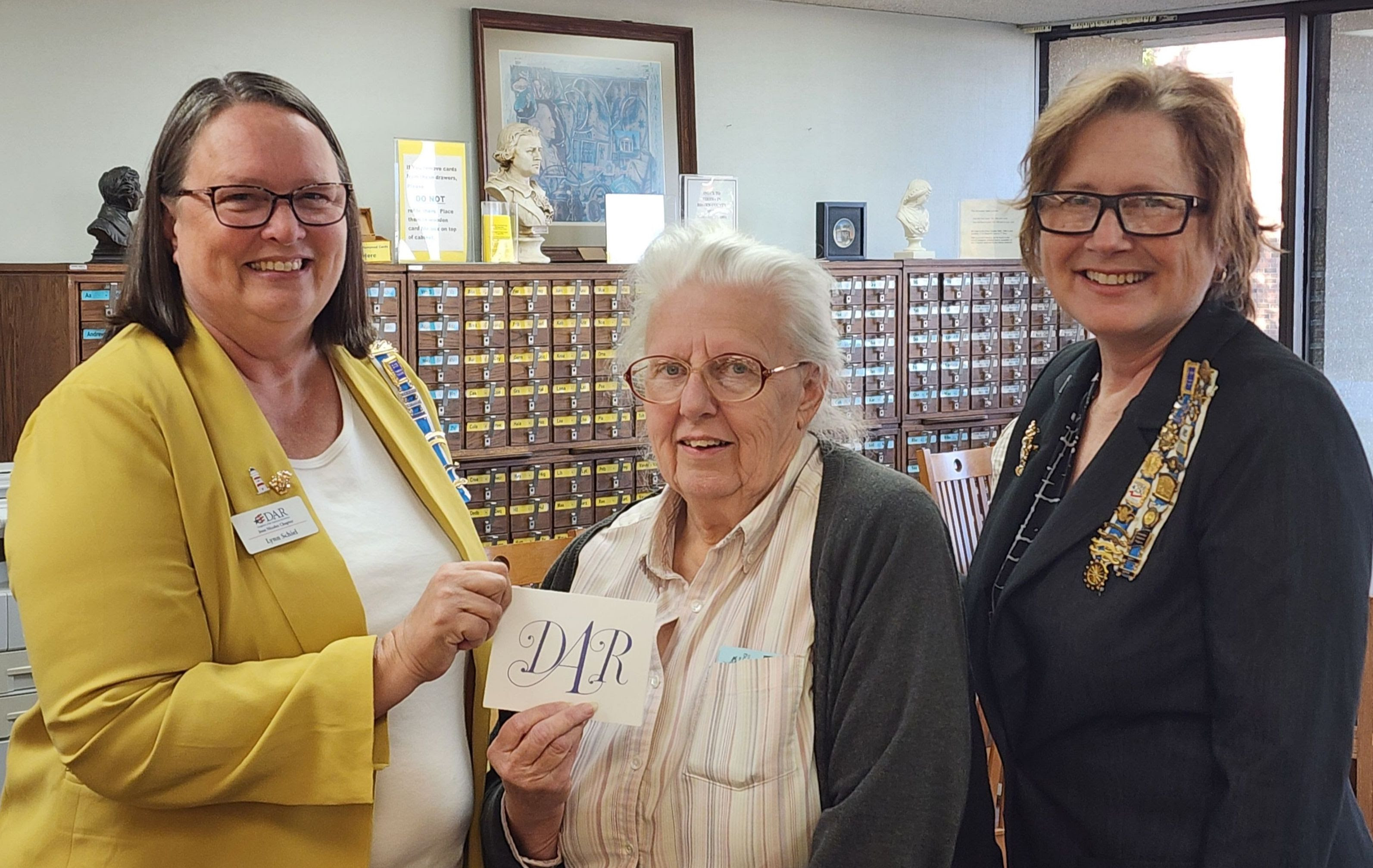 two DAR members presenting a donation to the Brown County Library