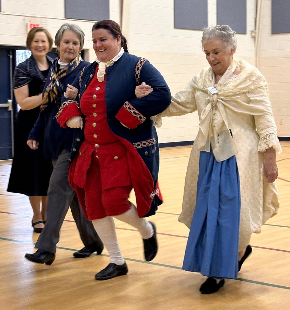 women participating in a traditional colonial dance