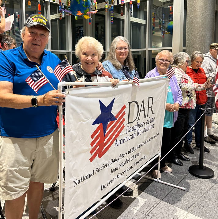people at the Appleton airport celebrating an Honor Flight