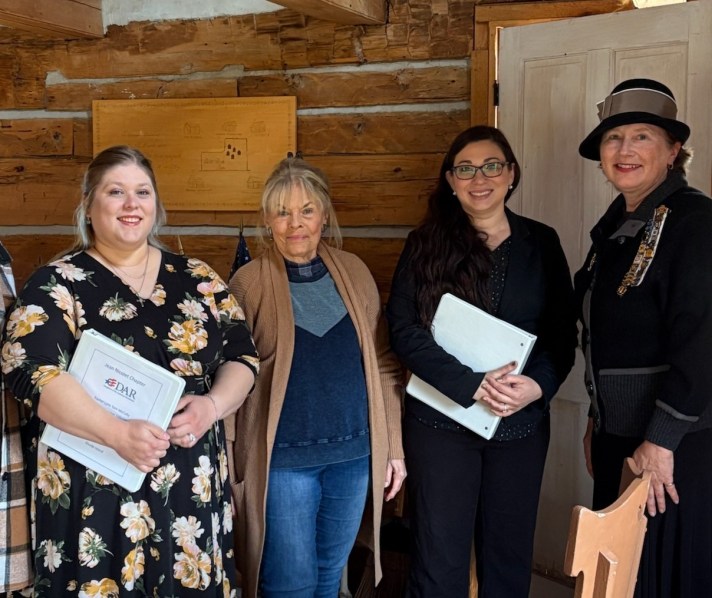 new members receiving their materials after being sworn in